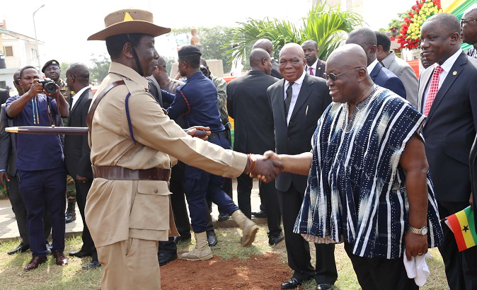 President Akufo-Addo in a handshake with WO1 Bernard Amoah (left), leader of the VAG members. Looking on are Commander Steve Obimpeh (retd) (middle), President of VAG, and Mr Dominic Nitiwul (right), the Minister of Defence. Picture: SAMUEL TEI ADANO